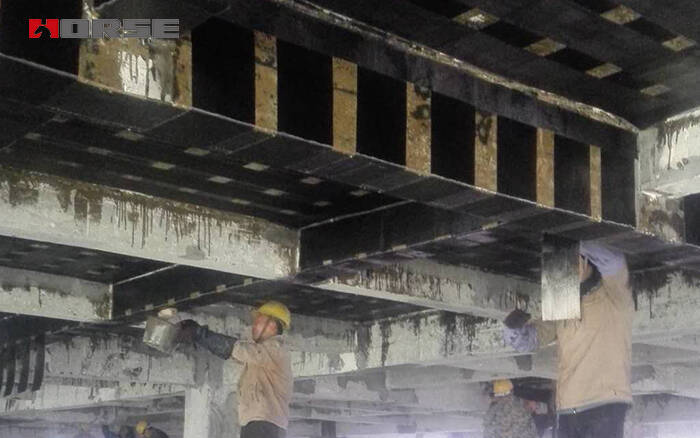 Carbon fiber retrofitting of concrete beams and slabs