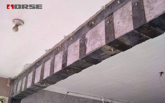 Strengthening concrete beams with steel plates