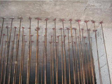 تعزيز جدران القص بطريقة توسيع المقطع (تثبيت التثبيت اللاحق)