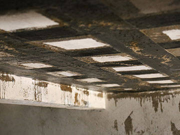 تركيب نسيج ألياف الكربون على هيكل خرساني مسلح متآكل